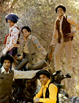 Cinco irmãos, um negócio de família. Michael em pé, à direita