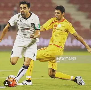 Hélio (à direita) durante um jogo no Qatar