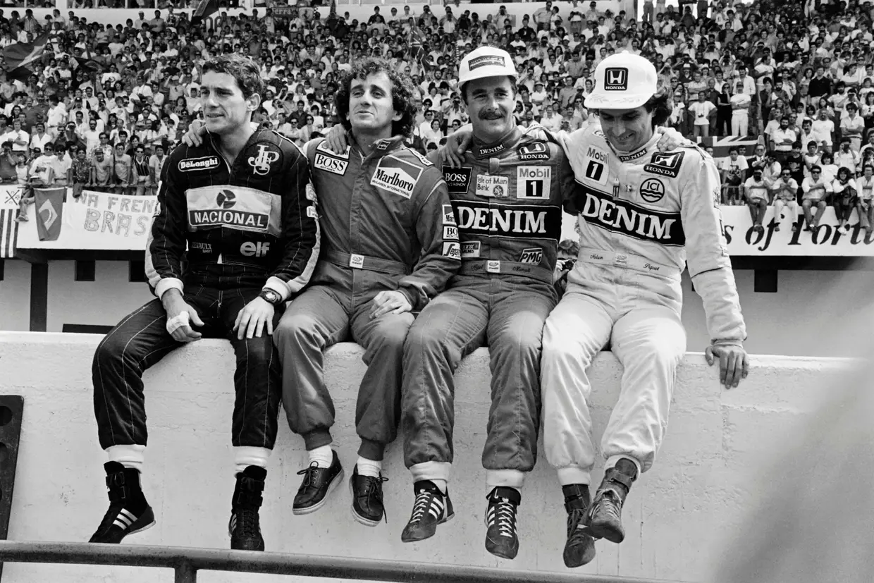 O miúdo e os seus três grandes rivais: Alain Prost, Nigel Mansell e Nelson Piquet, durante o GP Portugal de 1986