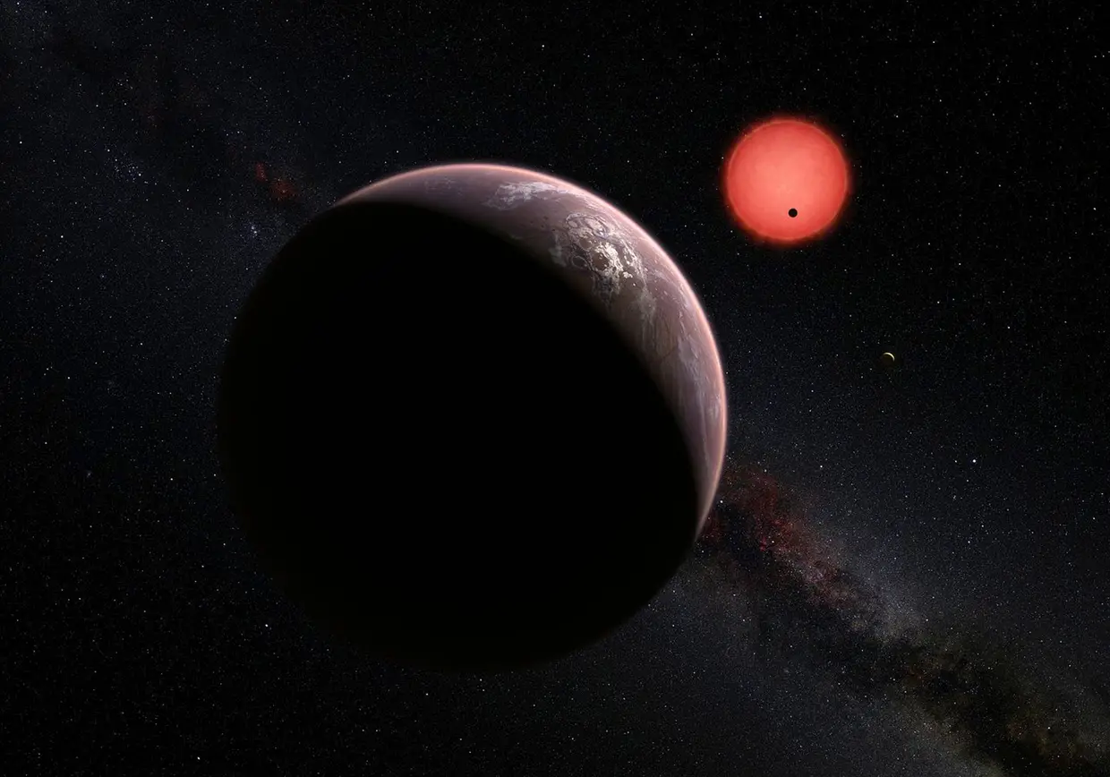 Três planetas a orbitar uma estrela-anã ultrafria, a 40 anos-luz da Terra, descobertos no Observatório La Silla, no Chile, em maio de 2016.