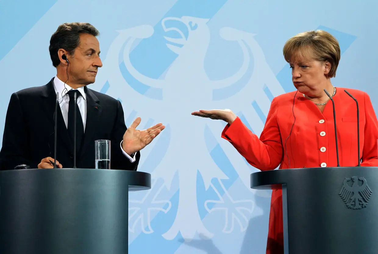 O na altura Presidente francês, Nicolas Sarkozy, e Angela Merkel, 2011