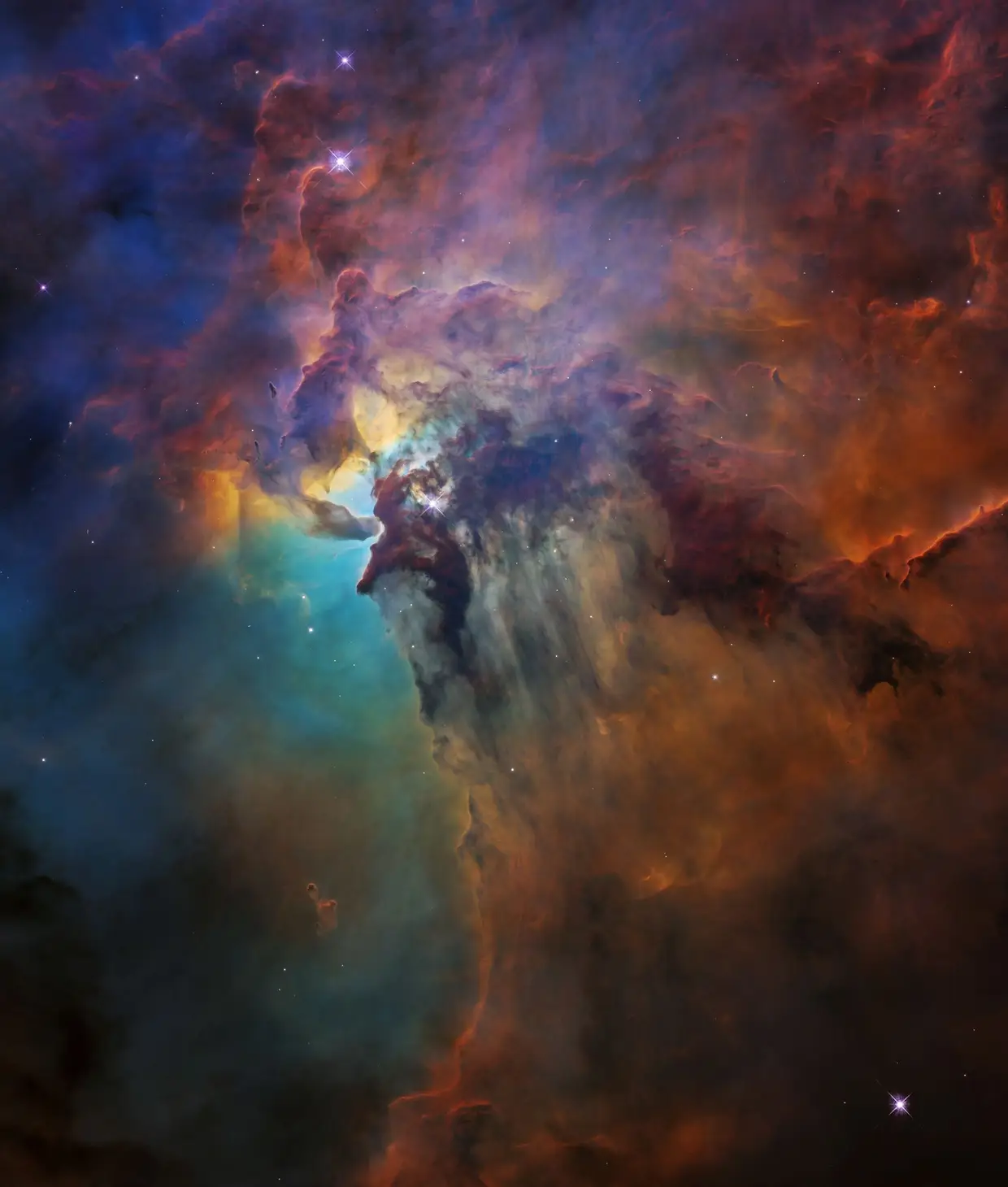 Uma imagem da Nebulosa Laguna (uma nuvem interestelar na constelação de Sagitário), tirada a partir do Telescópio Espacial Hubble da NASA/ESA. A Nebulosa Laguna está a cerca de 4000 anos-luz de distância, mede 55 anos-luz de largura e 20 anos-luz de altura.