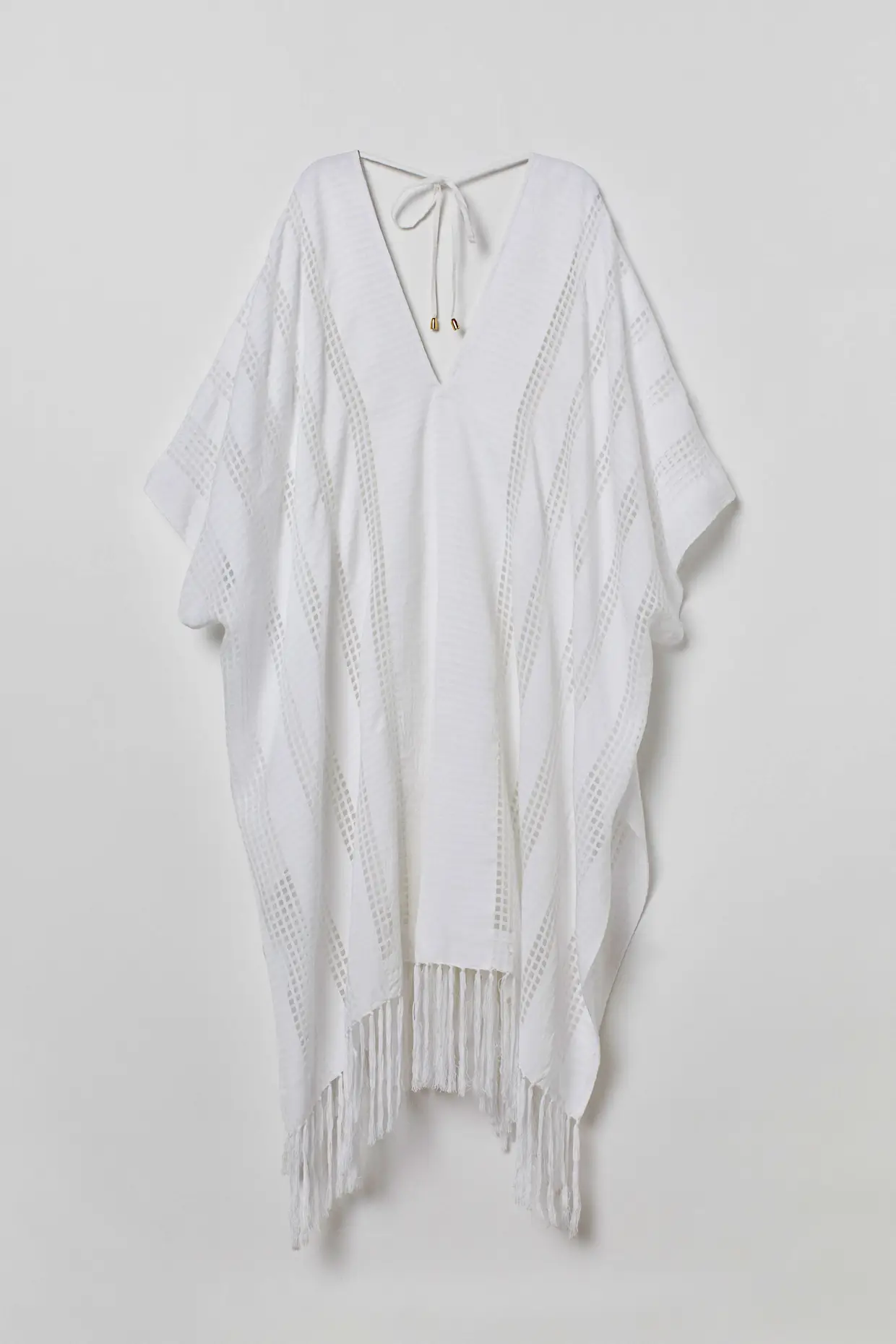 Poncho em tecido jacquard, H&M, €24,99