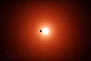 Simulação do momento em que um dos planetas atravessa a estrela anã-vermelha, provocando um eclipse e permitindo a deteção do TESS