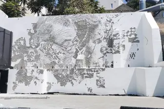 Mural com o rosto de Evaristo e Graça, da autoria do artista urbano Vhils