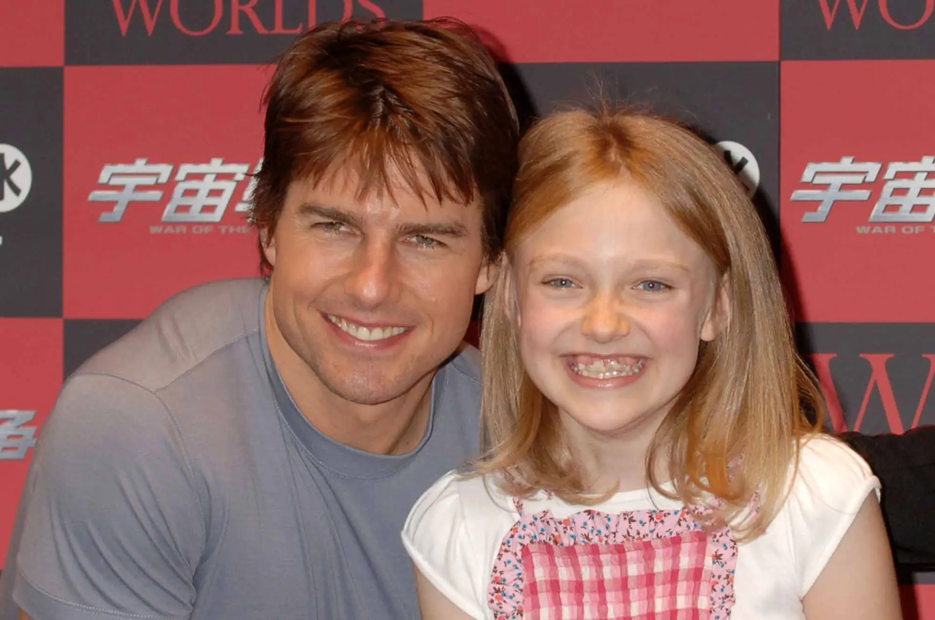 Tom Cruise e Dakota Fanning em 2005, ano em que estreou o filme "Guerra dos Mundos"