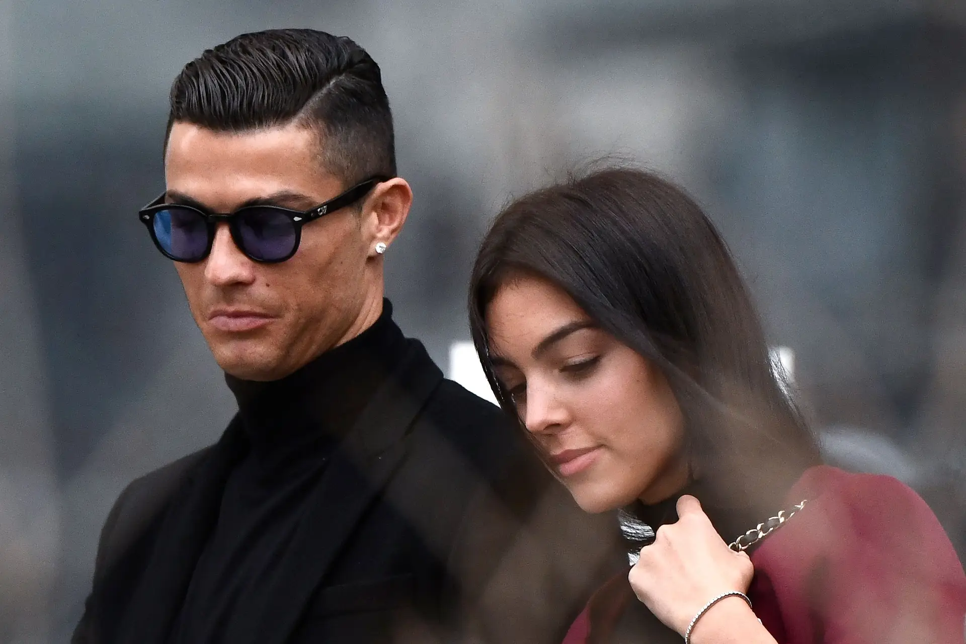 Juventus’ forward and former Real Madrid player Cristiano Ronaldo leaves with his Spanish girlfriend Georgina Rodriguez after attending a court hearing for tax evasion in Madrid on January 22, 2019. – Ronaldo is expected to be given a hefty fine after Spanish tax authorities and the player’s advisors made a deal to settle claims he hid income generated from image rights when he played for Real Madrid. (Photo by OSCAR DEL POZO / AFP) (Photo credit should read OSCAR DEL POZO/AFP via Getty Images)