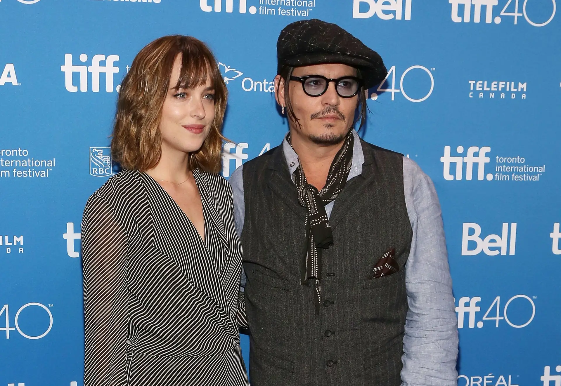 TORONTO, ON – SEPTEMBER 14: Dakota Johnson and Johnny Depp attend a photocall for “Black Mass” at TIFF Bell Lightbox during the 2015 Toronto International Film Festival on September 14, 2015 in Toronto, Canada. (Photo by Taylor Hill/FilmMagic)