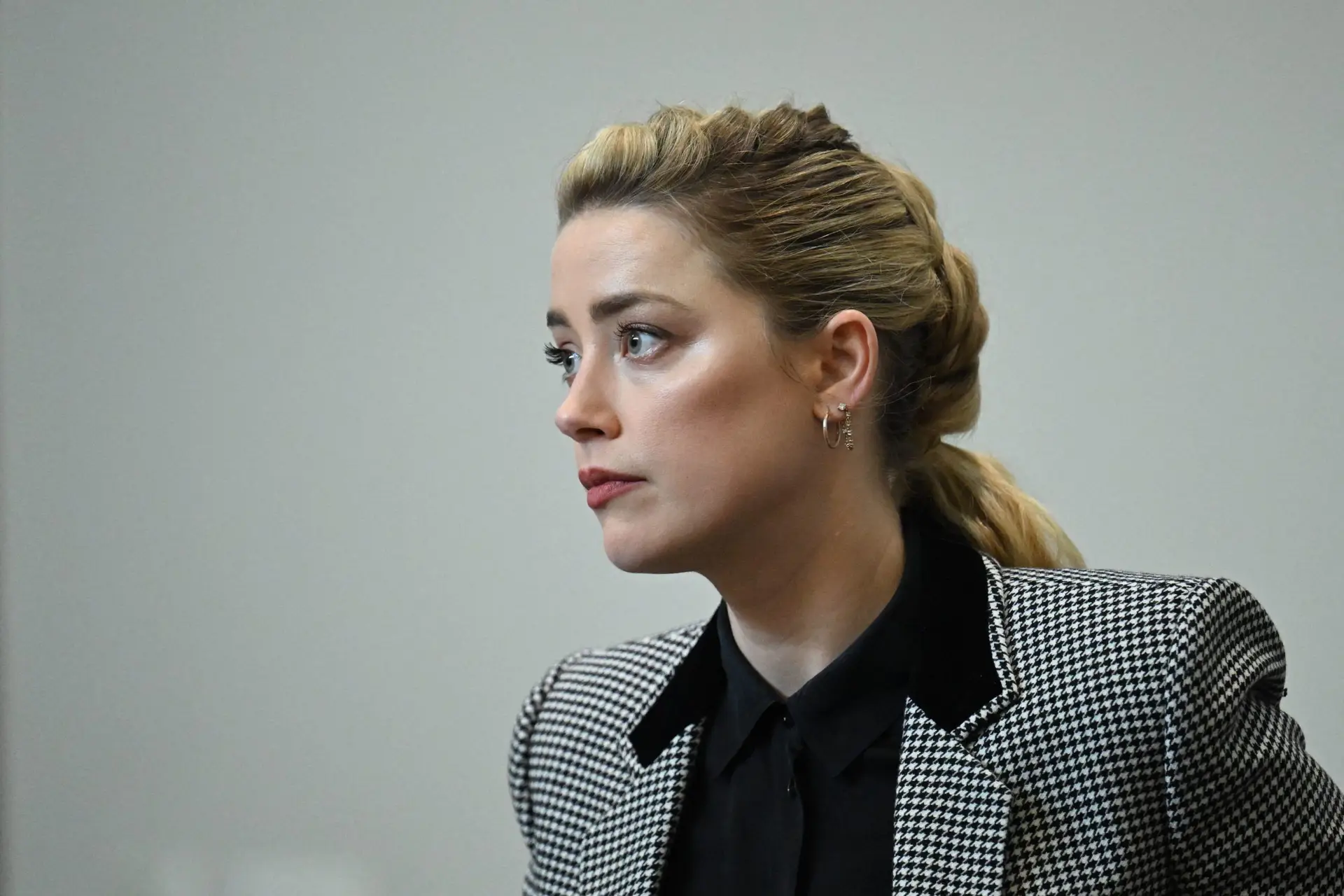 US actress Amber Heard attends the trial at the Fairfax County Circuit Courthouse in Fairfax, Virginia, on May 24, 2022. – Actor Johnny Depp is suing ex-wife Amber Heard for libel after she wrote an op-ed piece in The Washington Post in 2018 referring to herself as a public figure representing domestic abuse. (Photo by JIM WATSON / POOL / AFP) (Photo by JIM WATSON/POOL/AFP via Getty Images)