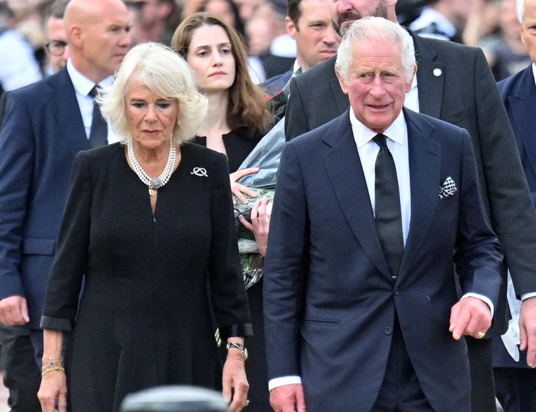 LONDON, ENGLAND – SEPTEMBER 09: King Charles III and Camilla, Queen Consort view floral tributes to the late Queen Elizabeth II outside Buckingham Palace on September 09, 2022 in London, United Kingdom. Elizabeth Alexandra Mary Windsor was born in Bruton Street, Mayfair, London on 21 April 1926. She married Prince Philip in 1947 and acceded the throne of the United Kingdom and Commonwealth on 6 February 1952 after the death of her Father, King George VI. Queen Elizabeth II died at Balmoral Castle in Scotland on September 8, 2022, and is succeeded by her eldest son, King Charles III. (Photo by Samir Hussein/WireImage)