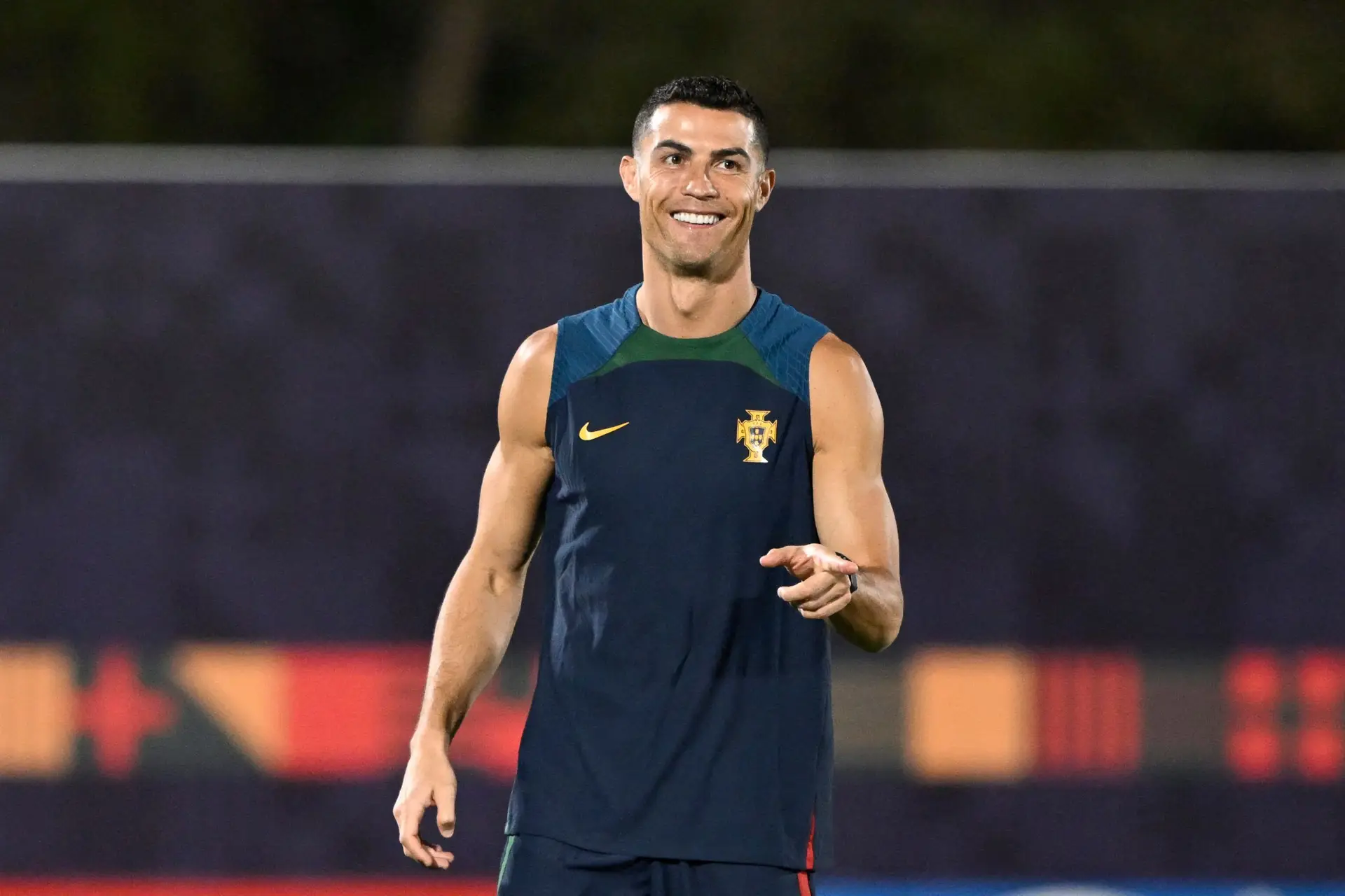 Portugal’s forward #07 Cristiano Ronaldo smiles as he takes part in a training session at Al Shahania SC in Al Samriya, northwest of Doha on November 27, 2022, on the eve of the Qatar 2022 World Cup football match between Portugal and Uruguay. (Photo by PATRICIA DE MELO MOREIRA / AFP) (Photo by PATRICIA DE MELO MOREIRA/AFP via Getty Images)