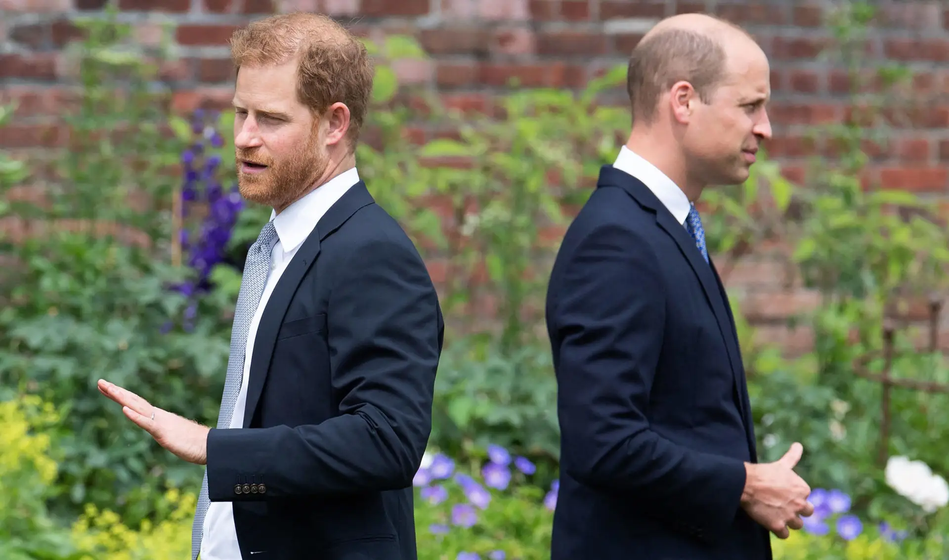 TOPSHOT – Britain’s Prince Harry, Duke of Sussex (L) and Britain’s Prince William, Duke of Cambridge attend the unveiling of a statue of their mother, Princess Diana at The Sunken Garden in Kensington Palace, London on July 1, 2021, which would have been her 60th birthday. – Princes William and Harry set aside their differences on Thursday to unveil a new statue of their mother, Princess Diana, on what would have been her 60th birthday. (Photo by Dominic Lipinski / POOL / AFP) (Photo by DOMINIC LIPINSKI/POOL/AFP via Getty Images)