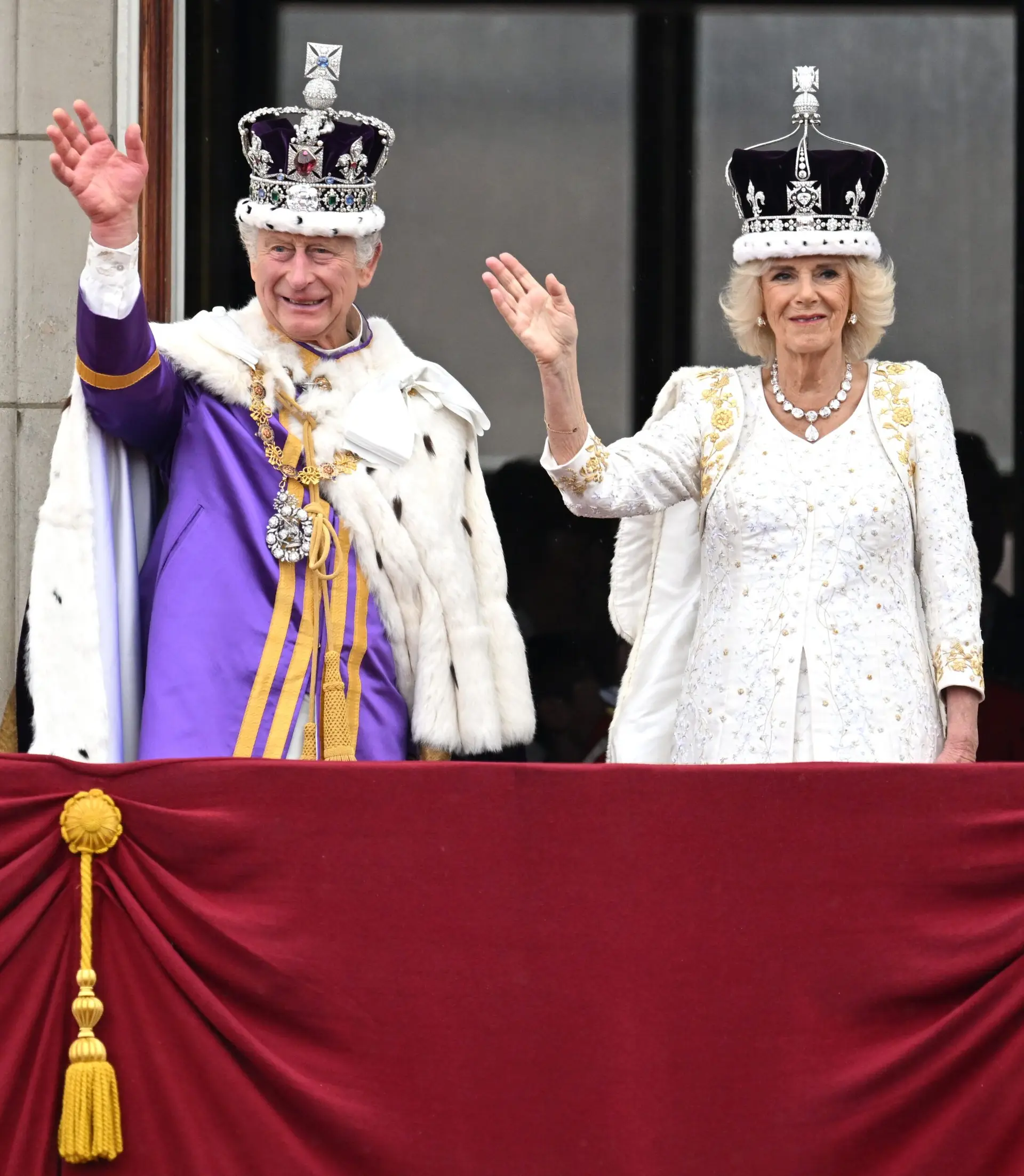 LONDON, ENGLAND – MAY 06: King Charles III and Queen Camilla wave from the Buckingham Palace balcony during the Coronation of King Charles III and Queen Camilla on May 06, 2023 in London, England. The Coronation of Charles III and his wife, Camilla, as King and Queen of the United Kingdom of Great Britain and Northern Ireland, and the other Commonwealth realms takes place at Westminster Abbey today. Charles acceded to the throne on 8 September 2022, upon the death of his mother, Elizabeth II. (Photo by Samir Hussein/WireImage)
