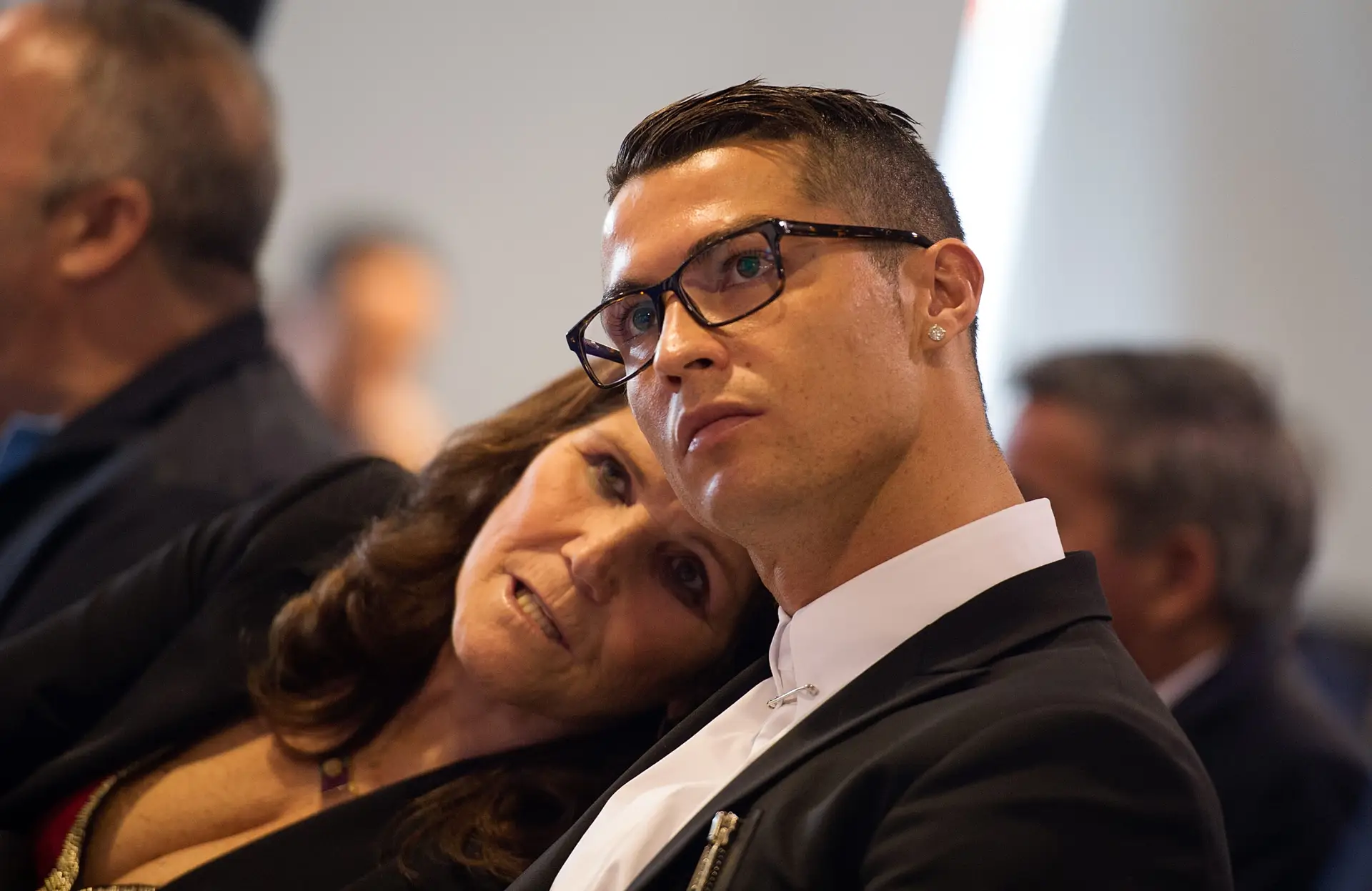 MADRID, SPAIN – NOVEMBER 07: Cristiano Ronaldo of Real Madrid looks on with his mother Maria Dolores dos Santos Aveiro during his press conference after signing a new five-year contract with the Spanish club at the Santiago Bernabeu stadium on November 7, 2016 in Madrid, Spain. (Photo by Denis Doyle/Getty Images)