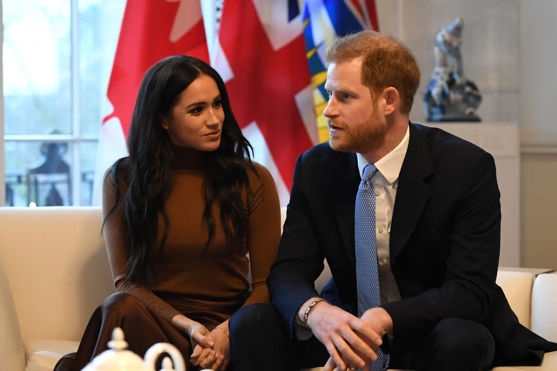 LONDON, UNITED KINGDOM – JANUARY 07: Prince Harry, Duke of Sussex and Meghan, Duchess of Sussex gesture during their visit to Canada House in thanks for the warm Canadian hospitality and support they received during their recent stay in Canada, on January 7, 2020 in London, England. (Photo by DANIEL LEAL-OLIVAS – WPA Pool/Getty Images)