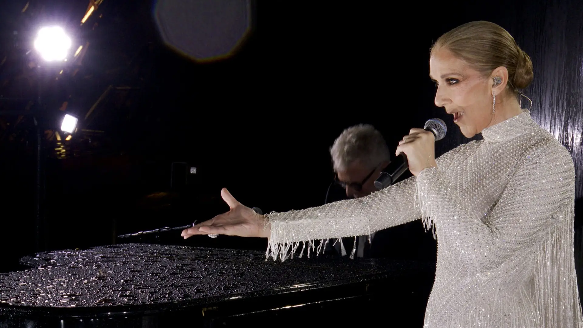 PARIS, FRANCE – JULY 26: (EDITOR’S NOTE: This Handout screengrab was provided by a third-party organization and may not adhere to Getty Images’ editorial policy.) This handout released by the Olympic Broadcasting Services, shows a view of singer Celine Dion performing on the Eiffel Tower during the opening ceremony of the Paris 2024 Olympic Games Paris 2024 on July 26, 2024 in Paris, France. (Screengrab by IOC via Getty Images)