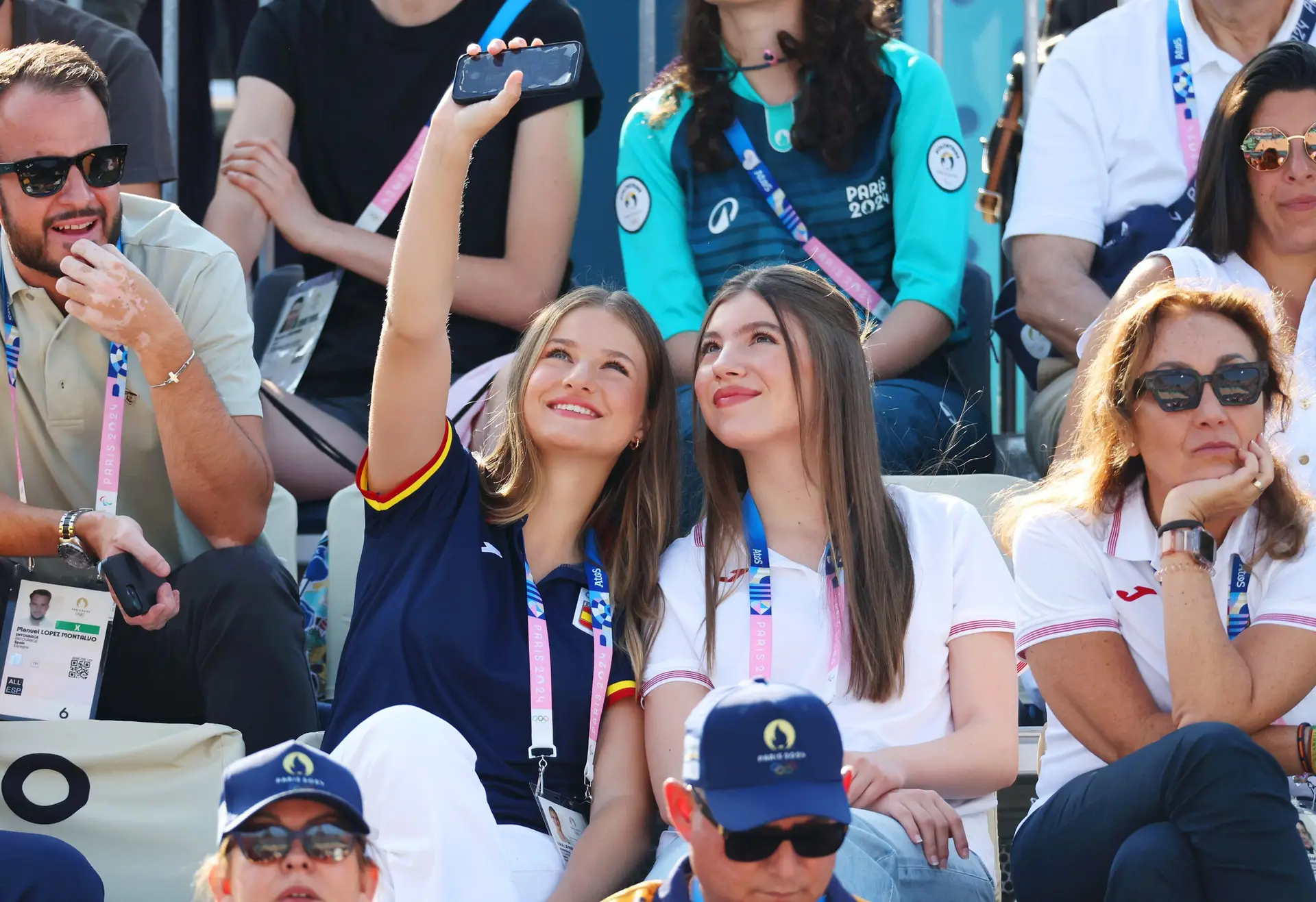 PARIS, FRANCE – JULY 29: Infanta Sofía of Spain and Leonor, Princess of Asturias take a selfie during day three of the Olympic Games Paris 2024 at Eiffel Tower Stadium on July 29, 2024 in Paris, France. (Photo by Pascal Le Segretain/Getty Images)