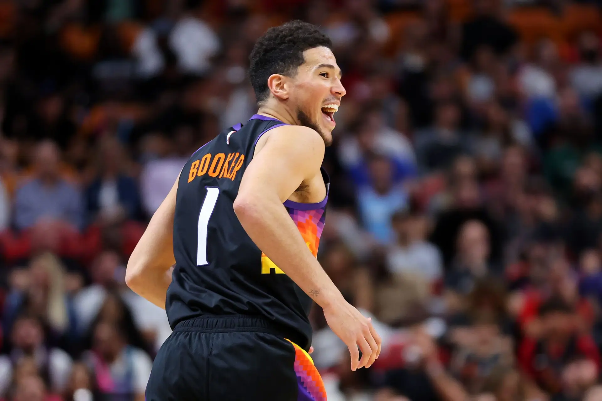 MIAMI, FLORIDA – MARCH 09: Devin Booker #1 of the Phoenix Suns celebrates against the Miami Heat during the second half at FTX Arena on March 09, 2022 in Miami, Florida. NOTE TO USER: User expressly acknowledges and agrees that, by downloading and or using this photograph, User is consenting to the terms and conditions of the Getty Images License Agreement. (Photo by Michael Reaves/Getty Images)
