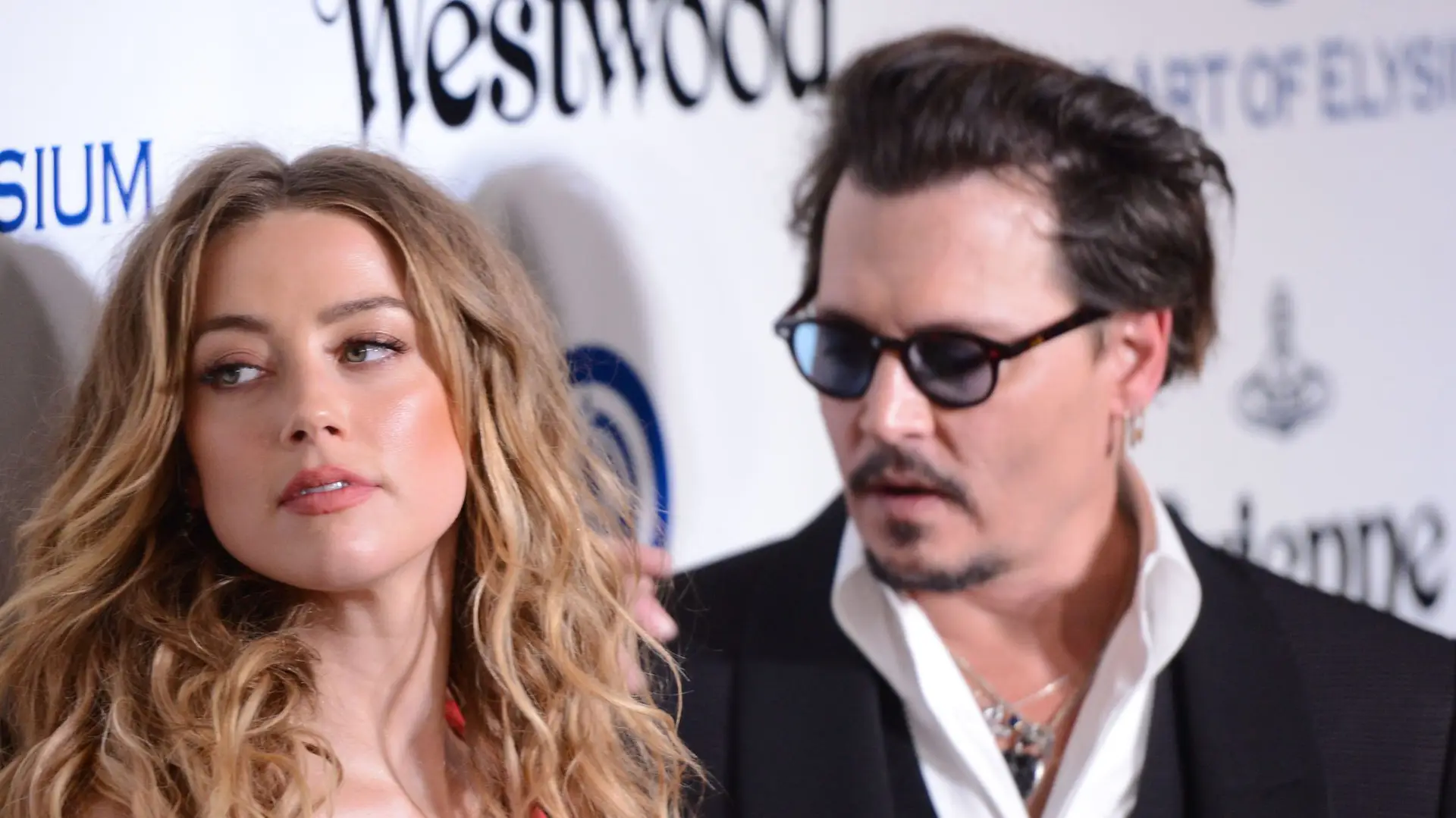 CULVER CITY, CA – JANUARY 09: Amber Heard and Johnny Depp attend the Art of Elysium 2016 HEAVEN Gala presented by Vivienne Westwood & Andreas Kronthaler at 3LABS on January 9, 2016 in Culver City, California. (Photo by C Flanigan/Getty Images)