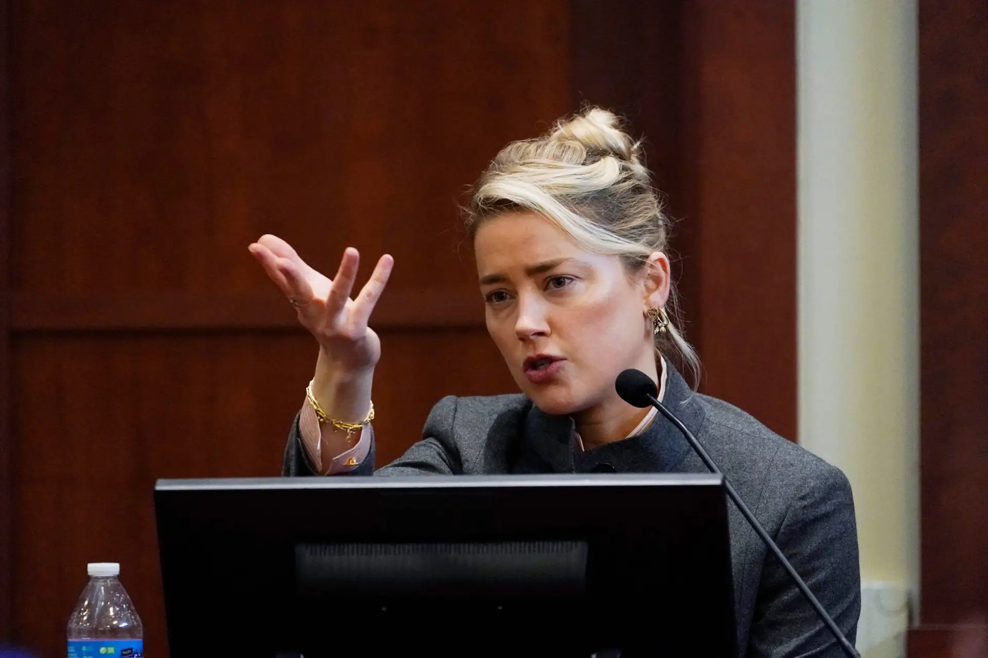 US actress Amber Heard testifies in the courtroom at the Fairfax County Circuit Courthouse in Fairfax, Virginia, on May 16, 2022. – Actor Johnny Depp sued his ex-wife Amber Heard for libel in Fairfax County Circuit Court after she wrote an op-ed piece in The Washington Post in 2018 referring to herself as a “public figure representing domestic abuse.” (Photo by Steve Helber / POOL / AFP) (Photo by STEVE HELBER/POOL/AFP via Getty Images)