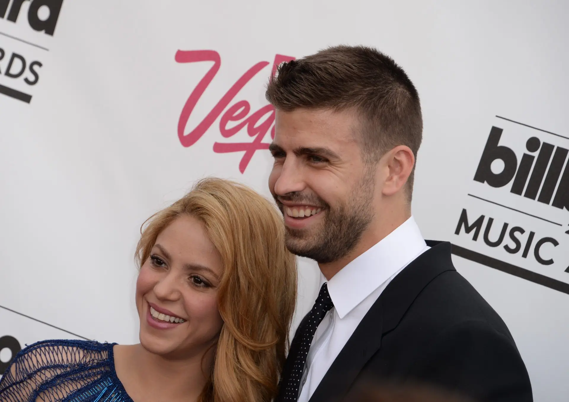 Colombian singer Shakira and her boyfriend Spanish soccer player Gerard Pique arrive at the 2014 Billboard Music Awards, May 18, 2014 at the MGM Grand Garden Arena, in Las Vegas, Nevada. AFP PHOTO / ROBYN BECK (Photo credit should read ROBYN BECK/AFP via Getty Images)