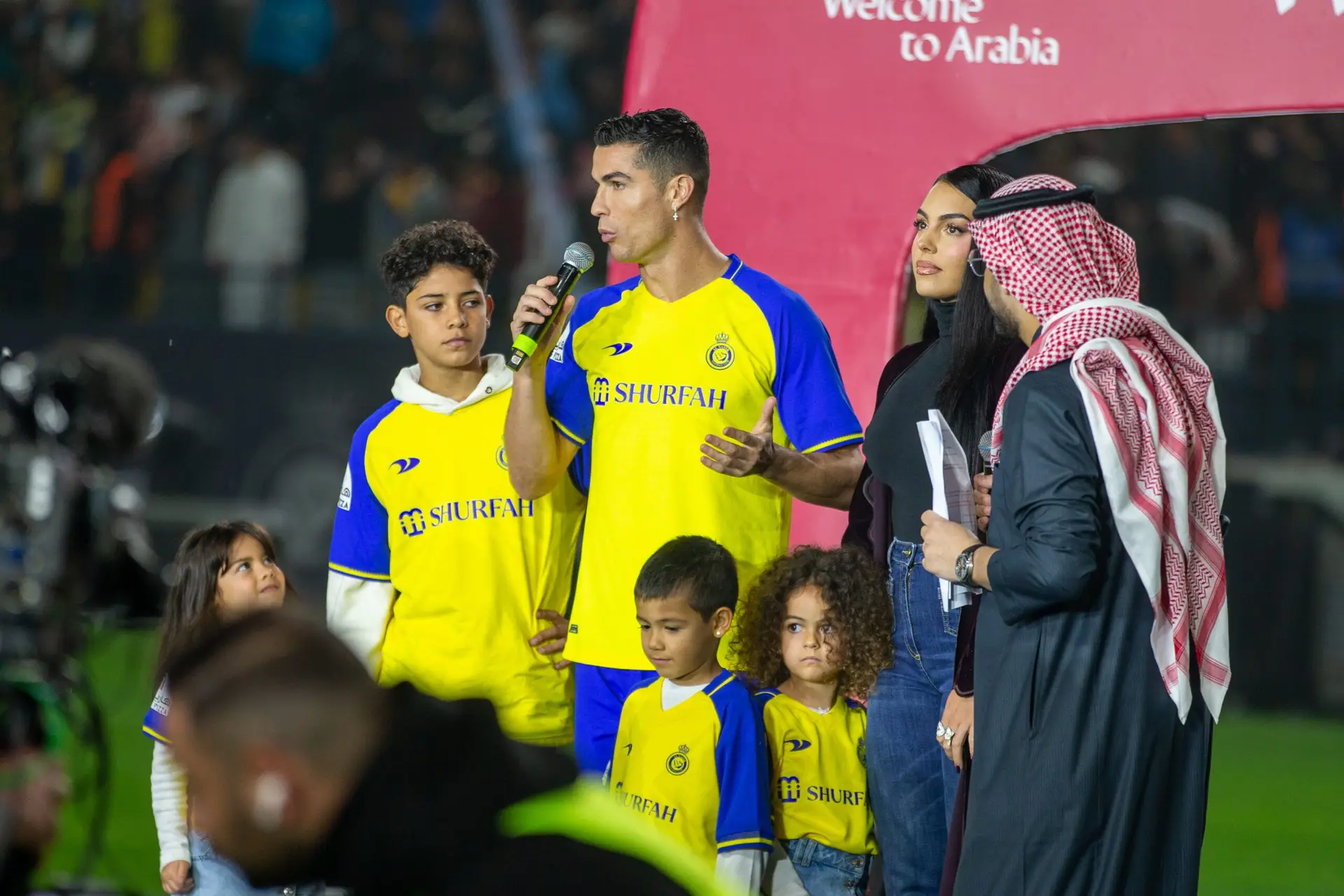 RIYADH, SAUDI ARABIA – JANUARY 03: Cristiano Ronaldo accompanied by his partner Georgina Rodriguez and his son Cristiano Ronaldo Jr, greet the crowd during the official unveiling of Cristiano Ronaldo as an Al Nassr player at Mrsool Park Stadium on January 3, 2023 in Riyadh, Saudi Arabia. (Photo by Yasser Bakhsh/Getty Images)
