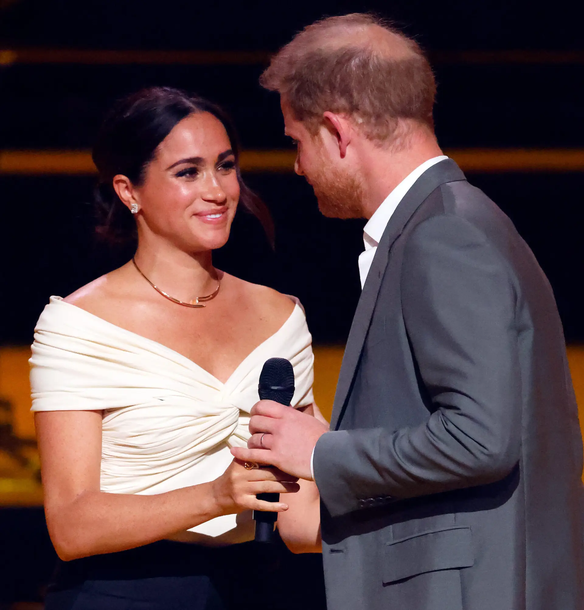 THE HAGUE, NETHERLANDS – APRIL 16: (EMBARGOED FOR PUBLICATION IN UK NEWSPAPERS UNTIL 24 HOURS AFTER CREATE DATE AND TIME) Meghan, Duchess of Sussex and Prince Harry, Duke of Sussex on stage during the Opening Ceremony of the Invictus Games 2020 at Zuiderpark on April 16, 2022 in The Hague, Netherlands. (Photo by Max Mumby/Indigo/Getty Images)