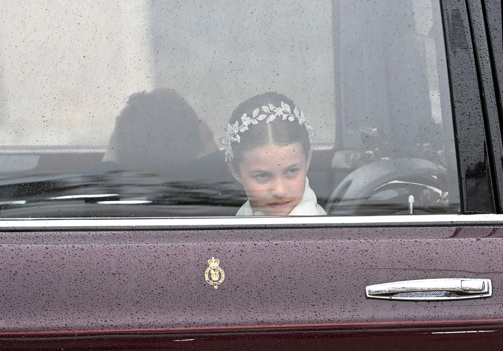 LONDON, ENGLAND – MAY 06: Princess Charlotte of Wales travelling in the state car during the Coronation of King Charles III and Queen Camilla on May 06, 2023 in London, England. The Coronation of Charles III and his wife, Camilla, as King and Queen of the United Kingdom of Great Britain and Northern Ireland, and the other Commonwealth realms takes place at Westminster Abbey today. Charles acceded to the throne on 8 September 2022, upon the death of his mother, Elizabeth II. (Photo by Stuart C. Wilson/Getty Images)