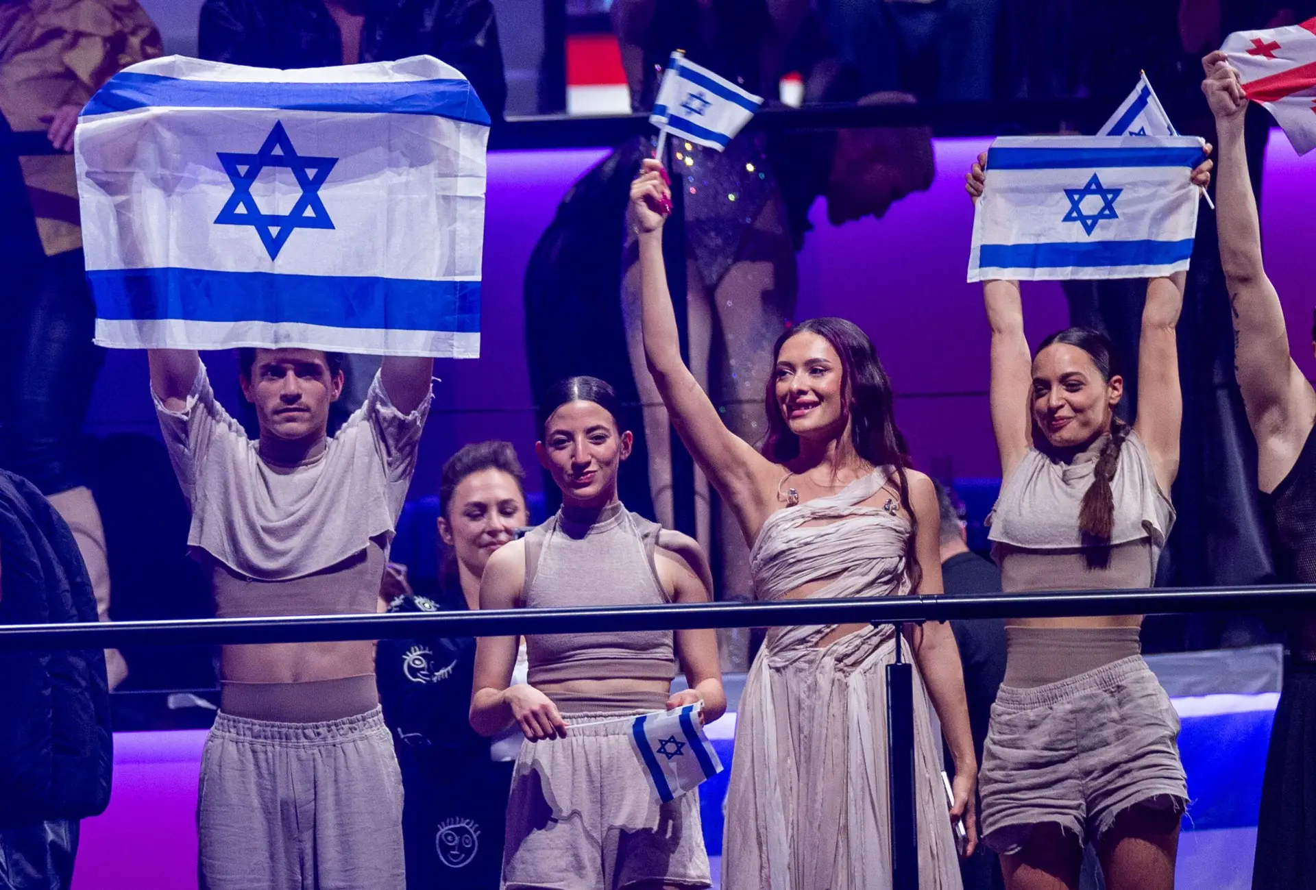 09 May 2024, Sweden, Malmö: Eden Golan (2nd from right) and her team from Israel celebrate after reaching the final of the Eurovision Song Contest (ESC) 2024. The motto of the world’s biggest singing competition is “United By Music”. Photo: Jens Büttner/dpa (Photo by Jens Büttner/picture alliance via Getty Images)