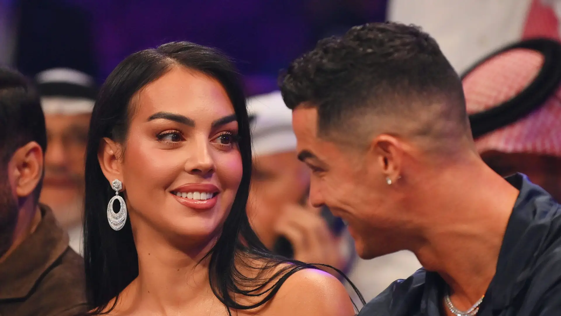 RIYADH, SAUDI ARABIA – OCTOBER 28: Cristiano Ronaldo and his wife Georgina Rodríguez speak ringside prior to the Heavyweight fight between Tyson Fury and Francis Ngannou at Boulevard Hall on October 28, 2023 in Riyadh, Saudi Arabia. (Photo by Justin Setterfield/Getty Images)