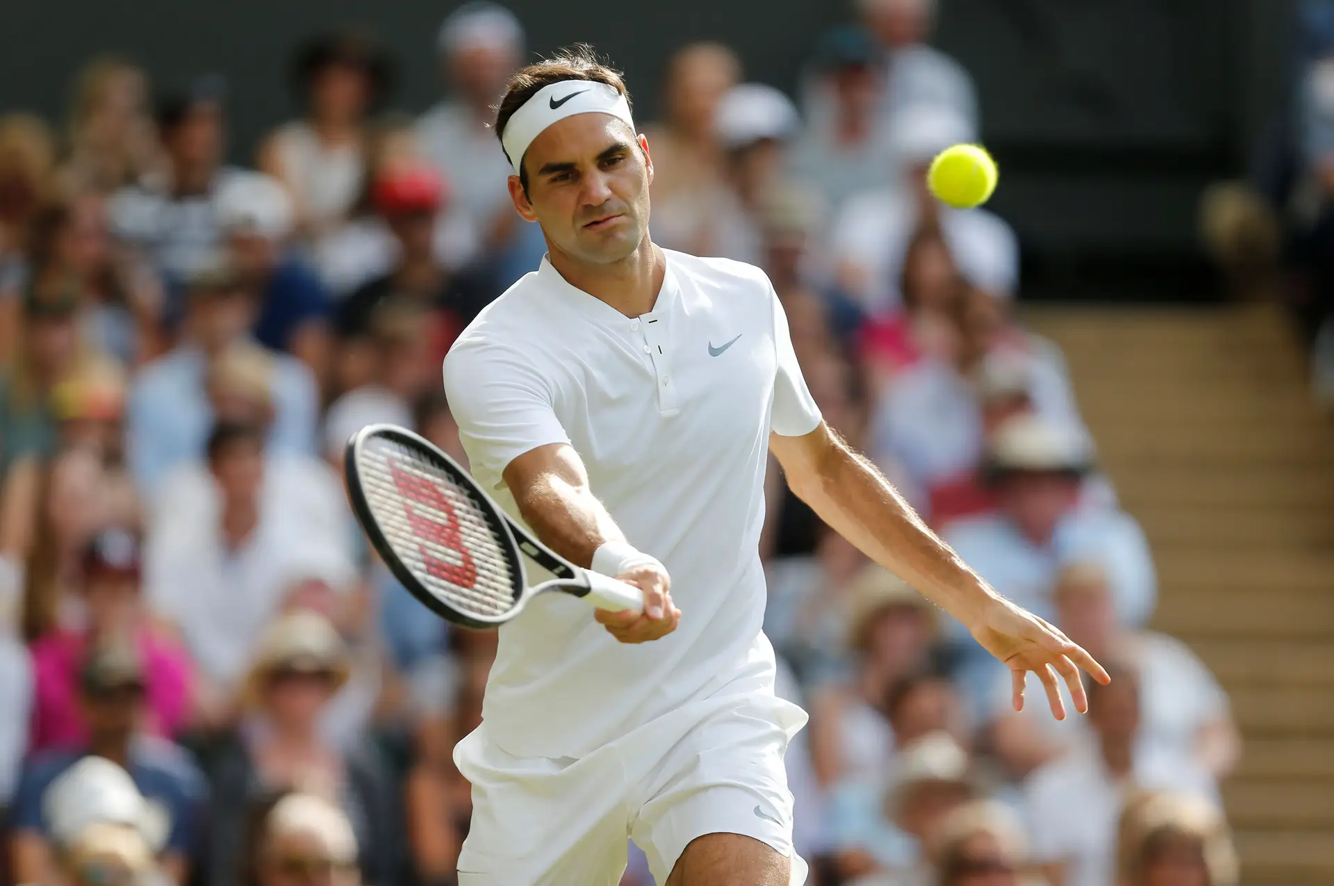 Federer segue para a 2.ª ronda de Wimbledon após desistência de Dolgopolov