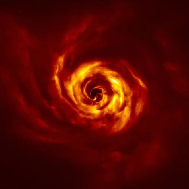 O disco em torno da estrela jovem AB Aurigae. Próximo do centro da imagem, na região interior do disco, vemos um "nodo" (a amarelo muito brilhante) que os cientistas acreditam marcar o local onde se está a formar um planeta.