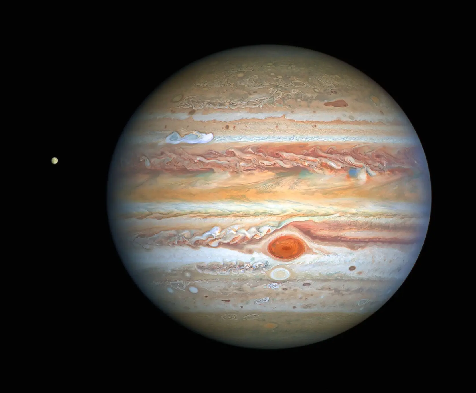 A fotografia tirada a Júpiter pelo telescópio espacial Hubble da NASA / ESA, a 25 de agosto de 2020, quando o planeta estava a 653 milhões de quilómetros da Terra oferece aos astrónomos um relatório meteorológico atualizado sobre a turbulenta atmosfera do planeta gigante. Uma notável tempestade está a formar-se. A imagem também mostra a lua gelada de Júpiter, Europa.