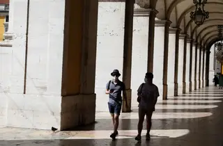 Tourists stroll through Lisbon