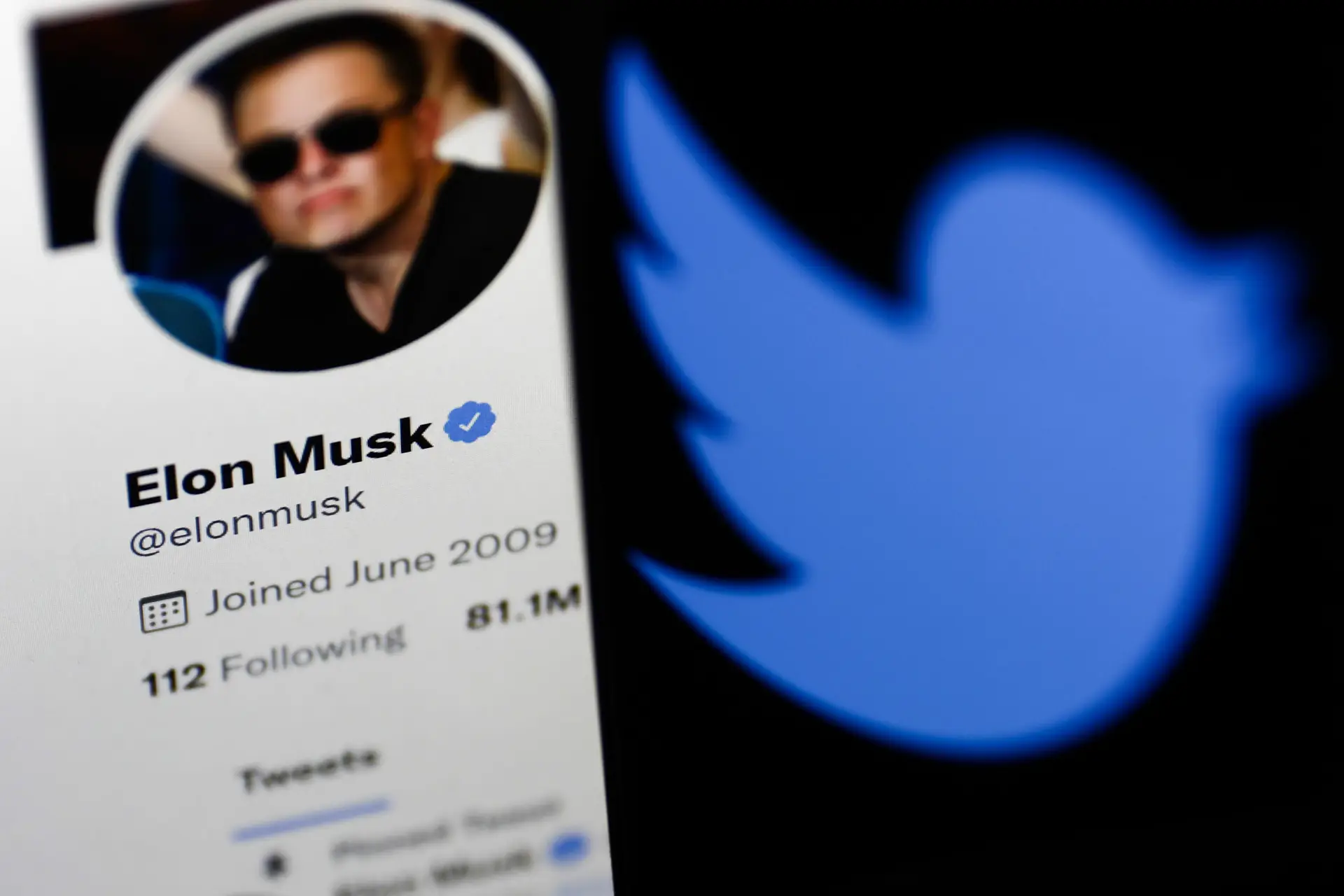 Elon Musk’s Twitter profile displayed on a computer screen and Twitter logo displayed on a phone screen are seen in this illustration photo taken in Krakow, Poland on April 9, 2022. (Photo by Jakub Porzycki/NurPhoto via Getty Images)