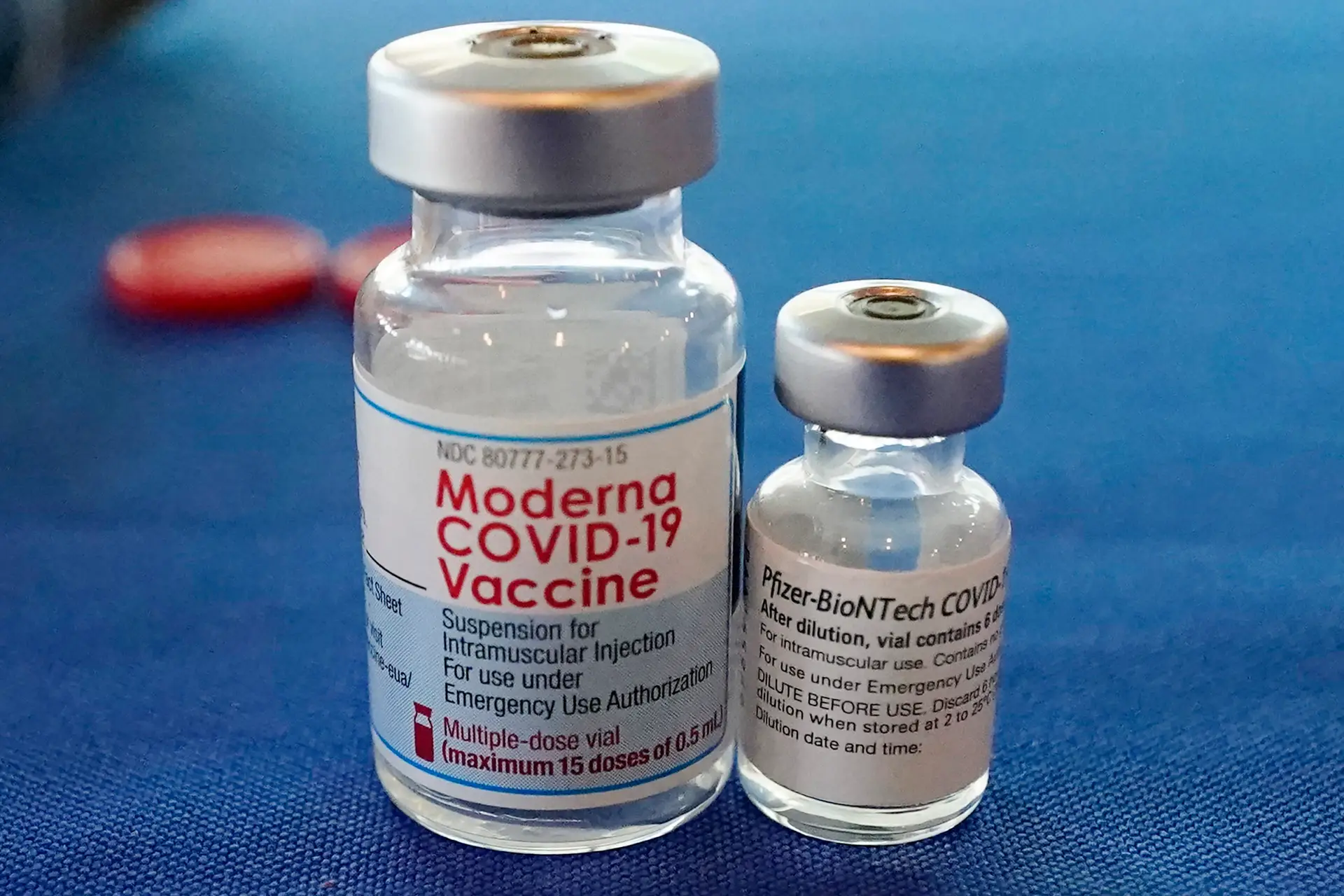 FILE – This Sept. 21, 2021 file photo shows vials of the Pfizer and Moderna COVID-19 vaccines in Jackson, Miss. Billions more in profits are at stake for some vaccine makers as the U.S. moves toward dispensing COVID-19 booster shots to shore up Americans’ protection against the virus. (AP Photo/Rogelio V. Solis)
