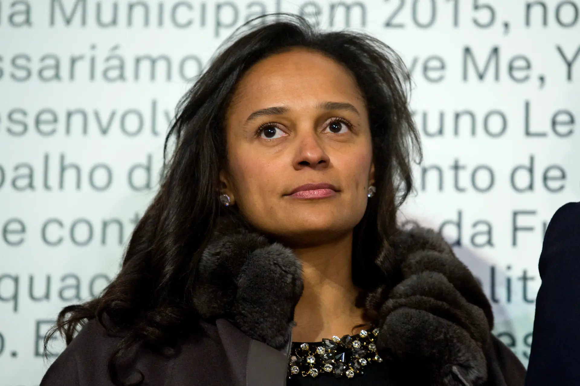 In this March 5, 2015 photo, Isabel dos Santos, reputedly Africa’s richest woman, attends the opening of an art exhibition featuring works from the collection of her husband and art collector Sindika Dokolo in Porto, Portugal. On Monday, Jan. 6, 2020, Angola’s foreign minister Manuel Augusto said that there is no political motivation behind the government’s demand for more than $1 billion from dos Santos, her husband and a Portuguese business partner. Isabel dos Santos is a daughter of Jose Eduardo dos Santos, who ruled the oil- and diamond-rich nation for 38 years until 2017. (AP Photo/Paulo Duarte)