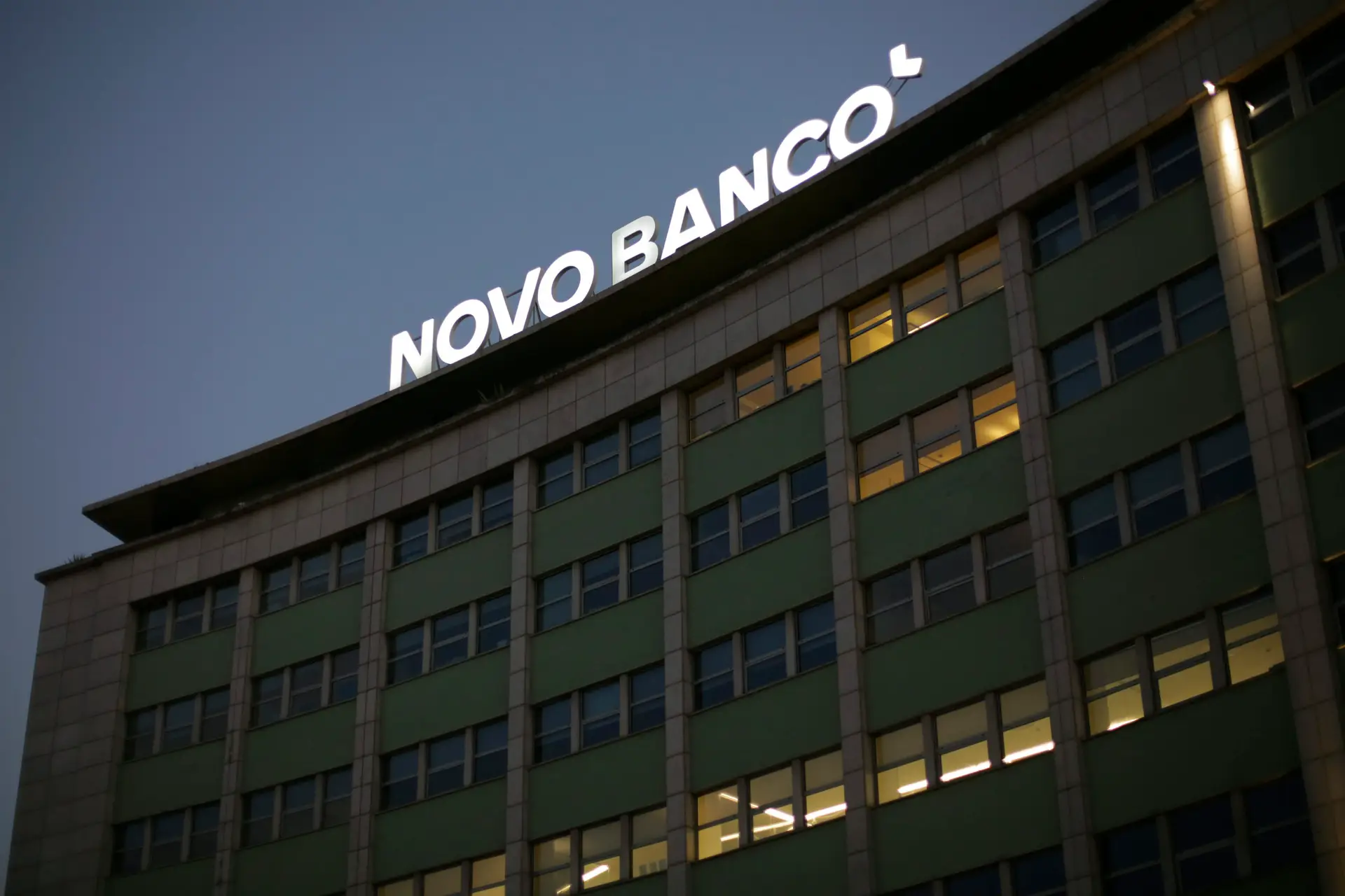 The logo of the Novo Banco bank is lit on the roof of one of their buildings in Lisbon, Thursday, Sept. 3, 2020. (AP Photo/Armando Franca)