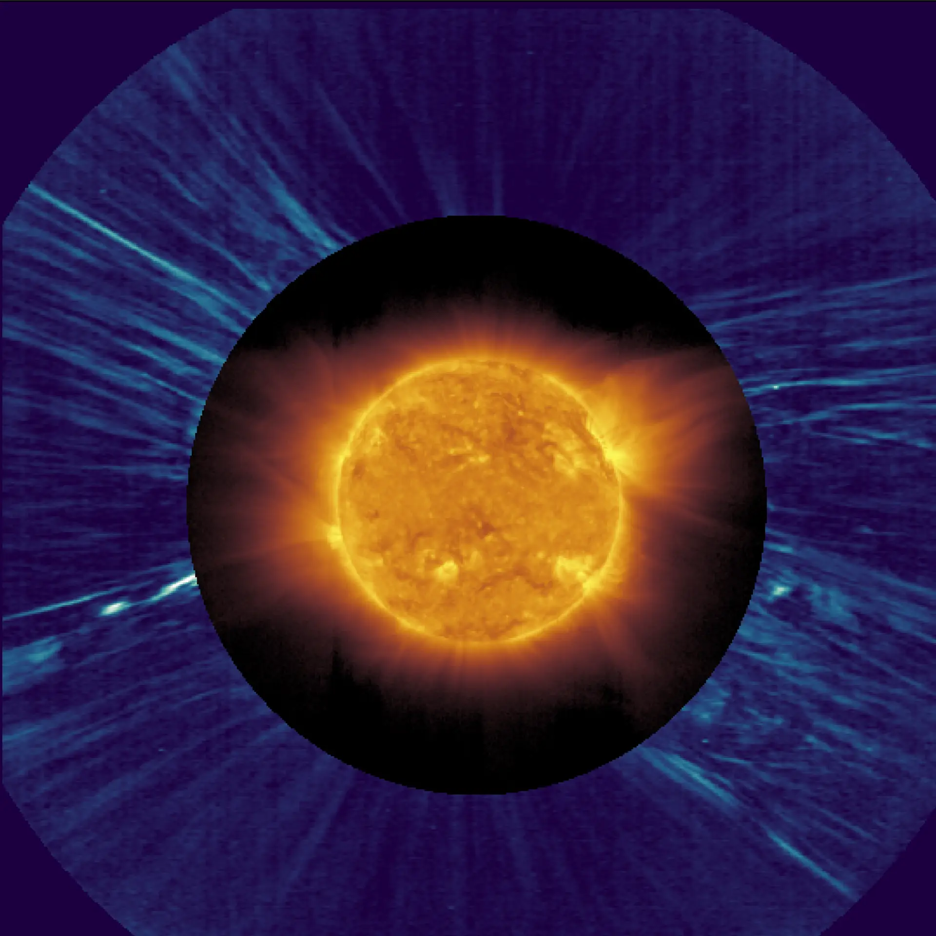 O Sol visto pela sonda Solar Orbiter da ESA/NASA em 25 de março de 2022, na véspera em que alcançou o ponto mais próximo da nossa estrela. A imagem central foi obtida pelo instrumento Extreme Ultraviolet Imager (EUI). A imagem externa foi tirada pelo instrumento Metis, que bloqueia a luz brilhante do Sol para se conseguir ver a coroa.