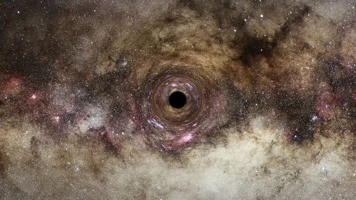 Numa galáxia no centro de um aglomerado maciço chamado Abell 1201, a cerca de 2,7 mil milhões de anos-luz da Terra, esconde-se um colosso cósmico: um buraco negro ultramassivo.