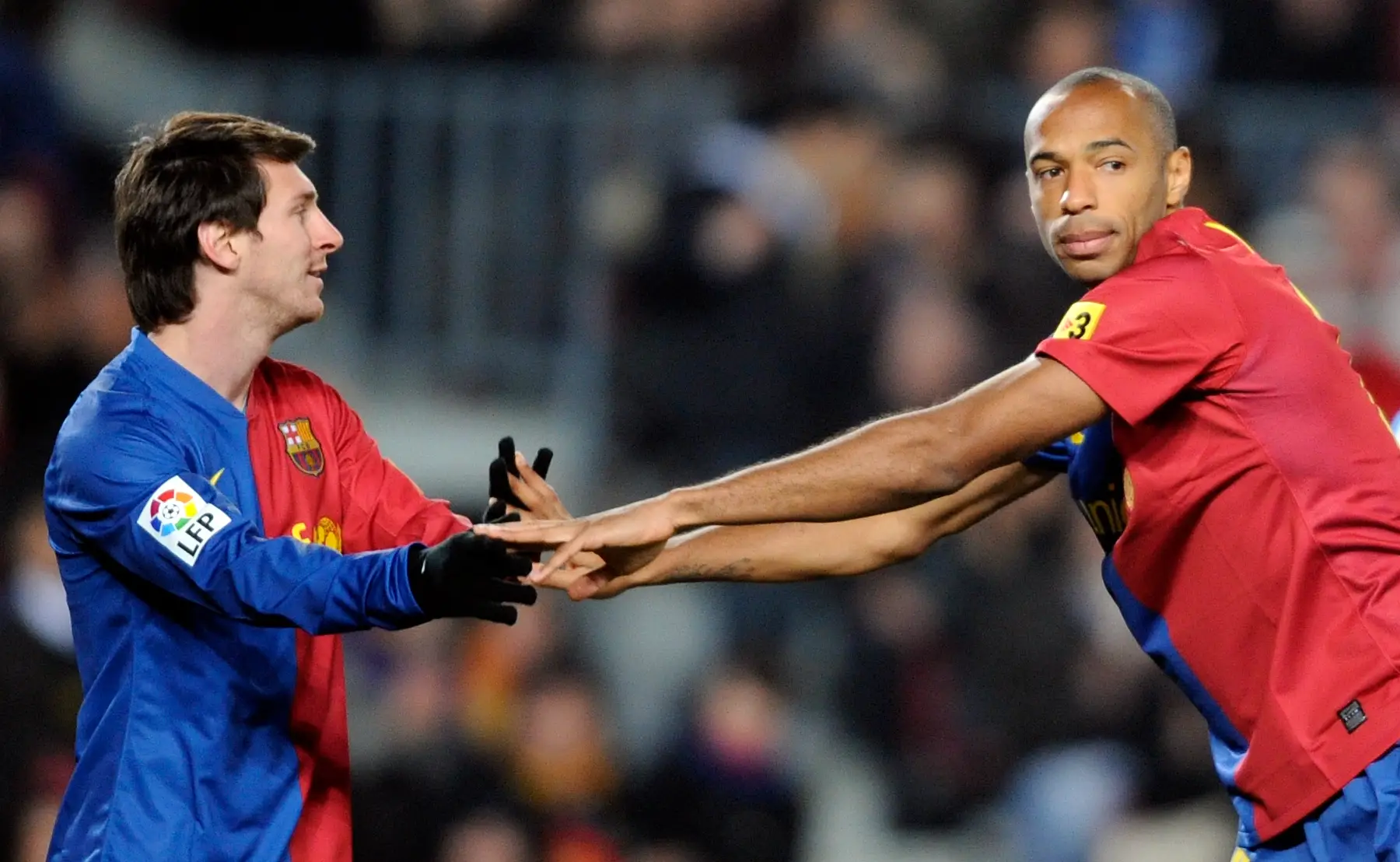 Lionel Messi e Thierry Henry durante uma partida da La Liga, no Camp Nou em Barcelona, em 2009.