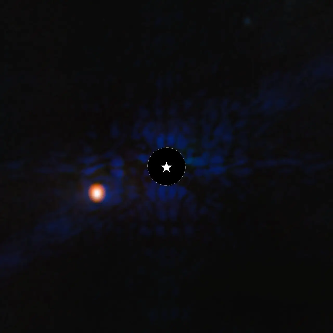 Esta imagem do exoplaneta gigante gasoso Epsilon Indi Ab foi obtida com o coronógrafo do MIRI (Instrumento de Infravermelho Médio) do Telescópio Espacial James Webb. Um símbolo de estrela marca a localização da estrela hospedeira Epsilon Indi A