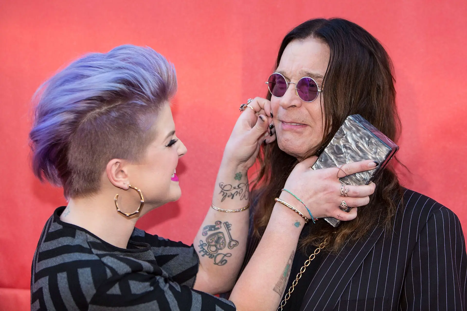 Kelly Osbourne e Ozzy Osbourne no 10.º Concerto Anual Beneficente MusiCares MAP Fund, no Club Nokia, a 12 de maio de 2014, em Los Angeles, Califórnia.